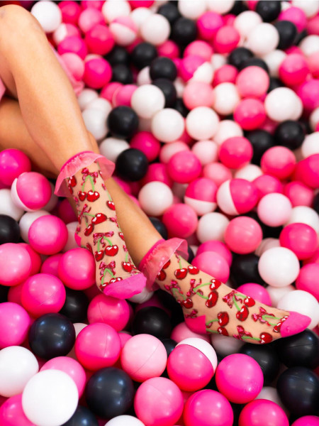 Chaussette transparente a volants avec nœud cerise