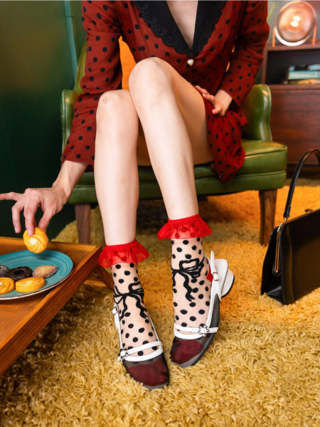 Chaussette transparente a volants avec nœud a pois