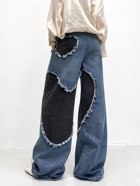 Jean wide leg bimatière patchwork bleu et noir à bords effilochés